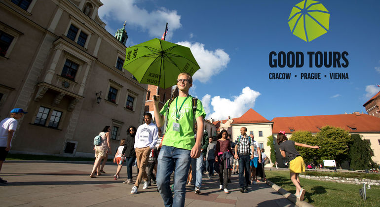 A walking tour guide leading a group on a Krakow city tour